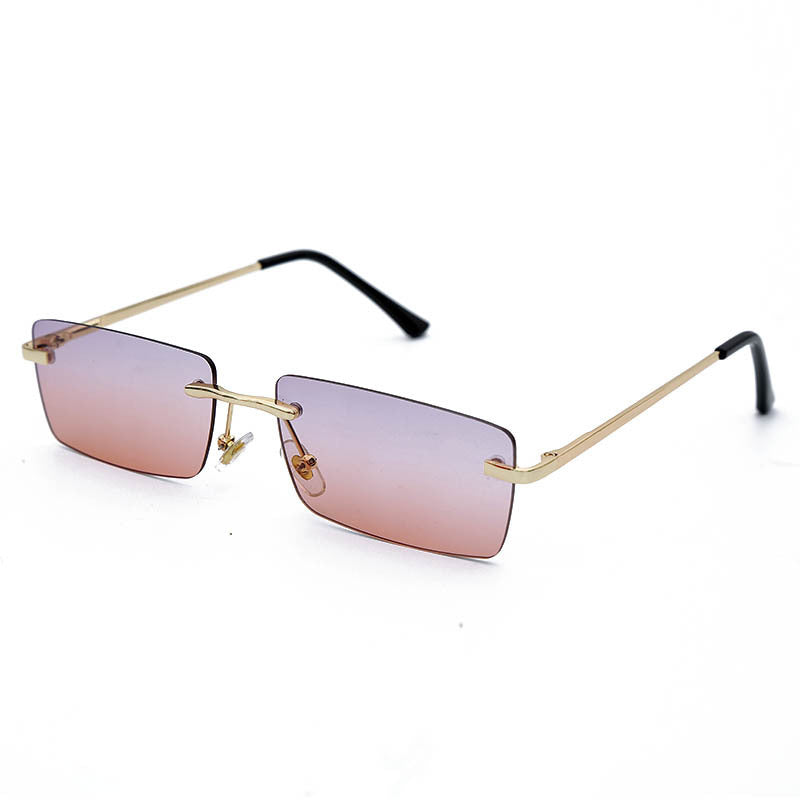 Lunettes de soleil rectangulaires sans monture au design minimaliste, avec branches dorées élégantes pour un look moderne et raffiné.