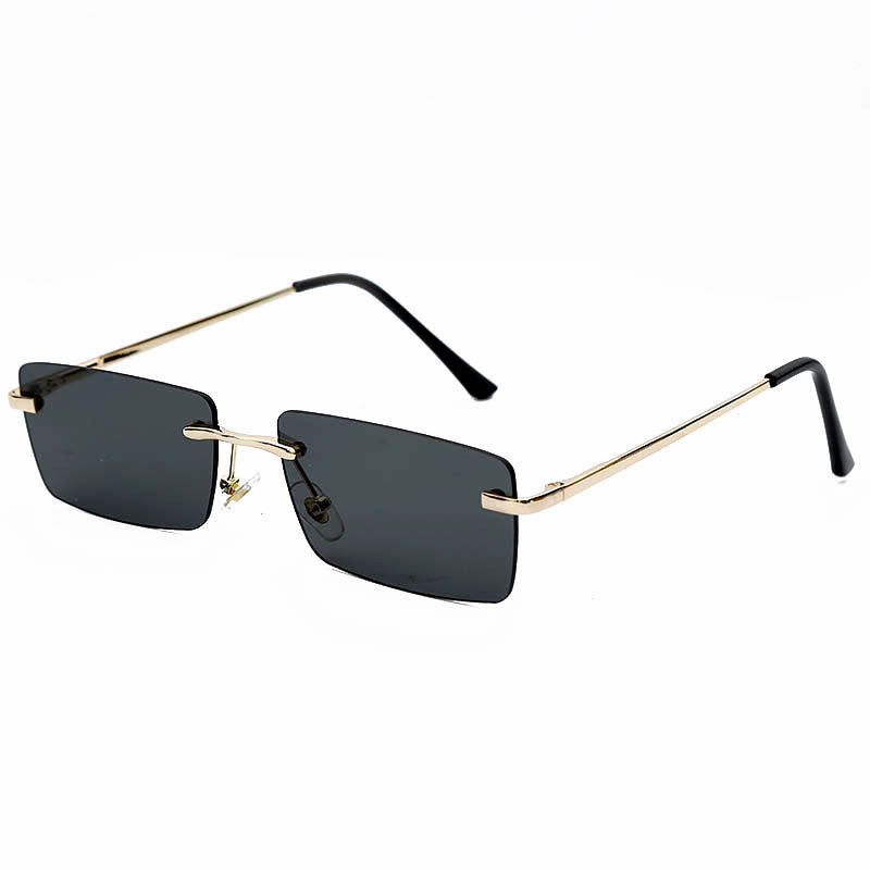 Lunettes de soleil rectangulaires sans monture au design minimaliste, avec branches dorées élégantes pour un look moderne et raffiné.
